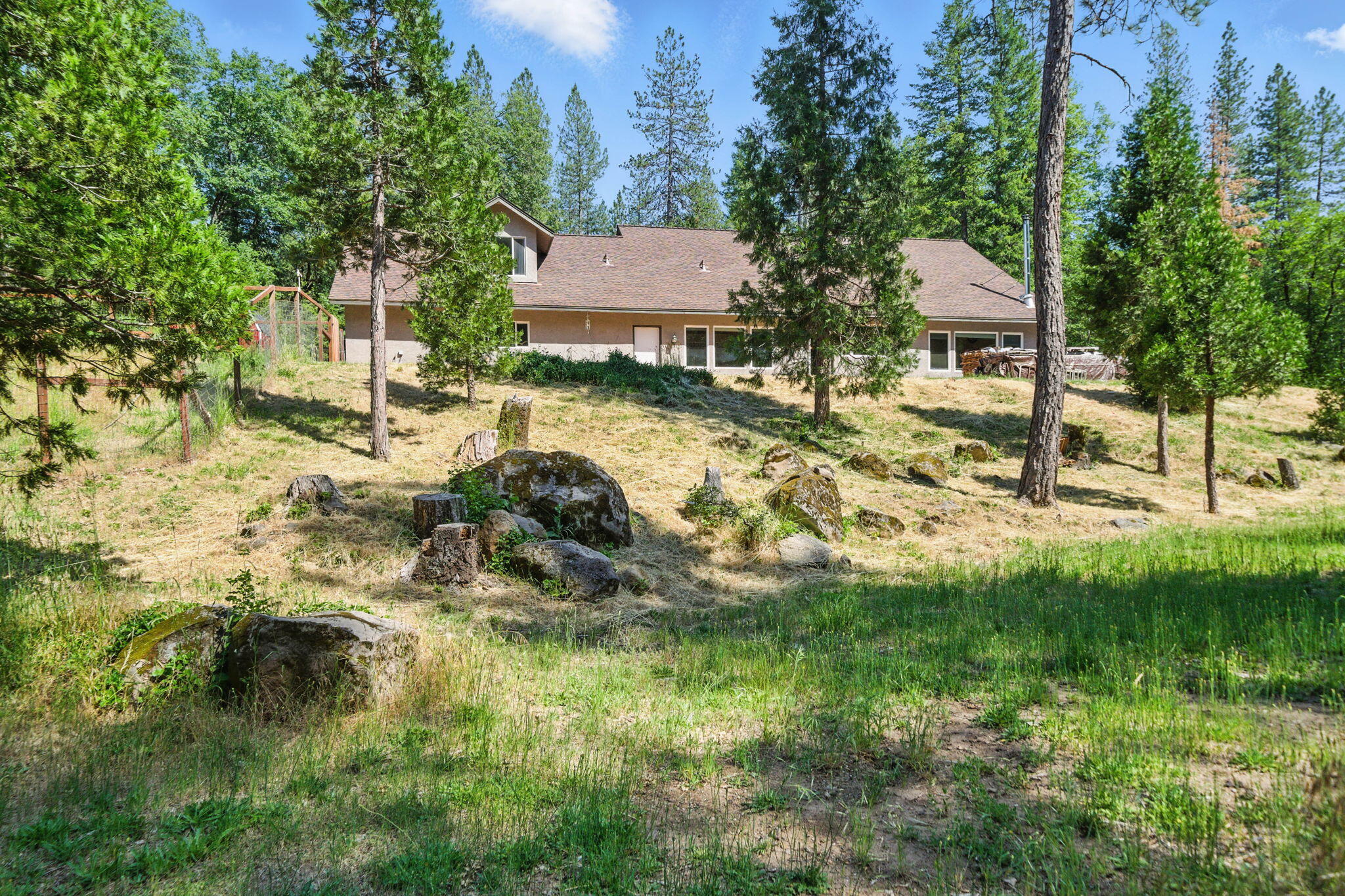 15399 Star Flower Road Oak Run, CA 96069 - Photo 27 of 44 a view of a house with a yard
