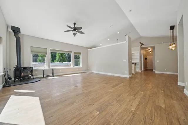 a view of a livingroom with a hardwood floor and a ceiling fan