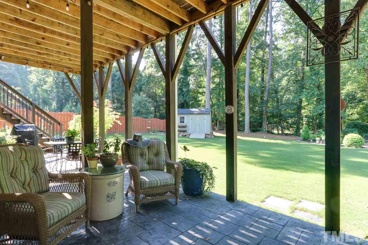 1103 Temple Street Raleigh, NC 27609 - Photo 28 of 30 Expansive stamped concrete patio overlooking flat private back yard