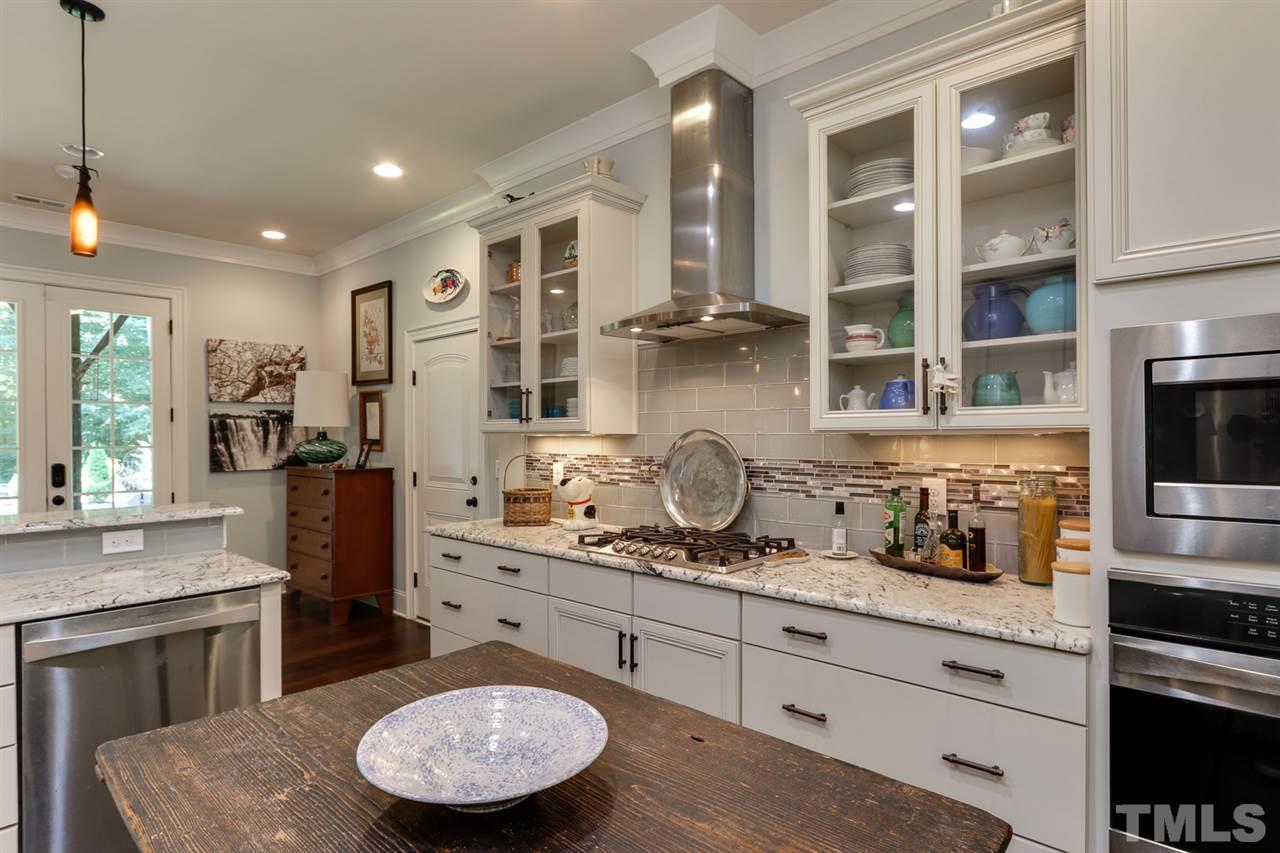 1103 Temple Street Raleigh, NC 27609 - Photo 7 of 30 Stunning custom lower level gourmet kitchen. Great for entertaining or as a potential in law home or rental opportunity!