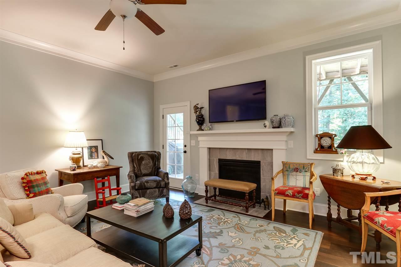 1103 Temple Street Raleigh, NC 27609 - Photo 8 of 30 Gorgeous lower level family room with fireplace and doors to the outdoor living space