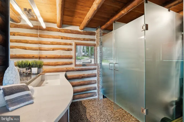 a bathroom with a tub and shower