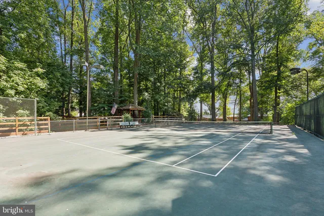 a view of a playground with basketball court