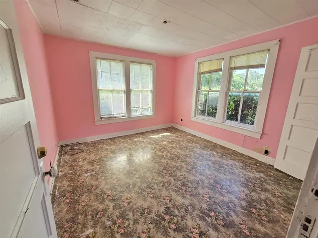 a view of a big room with windows