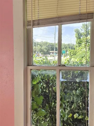 a view of a glass door with a roof deck