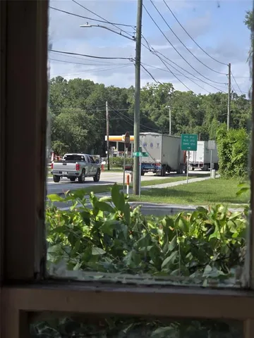 a view of a chair and table in the garden