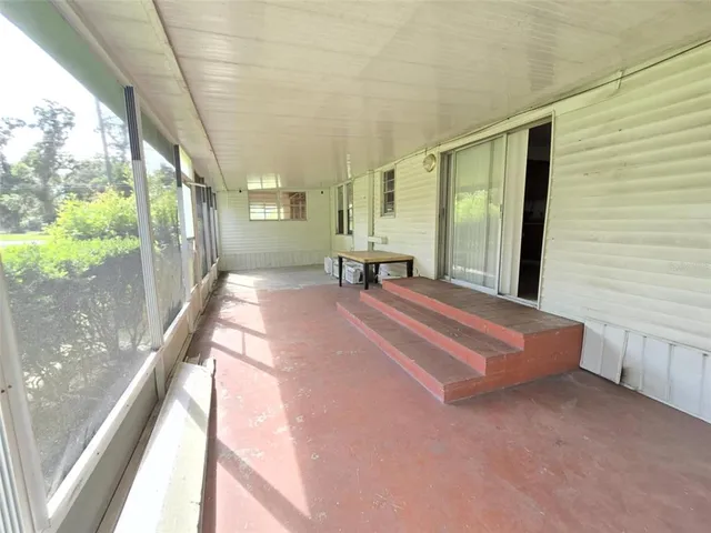 a view of a house with backyard from a patio