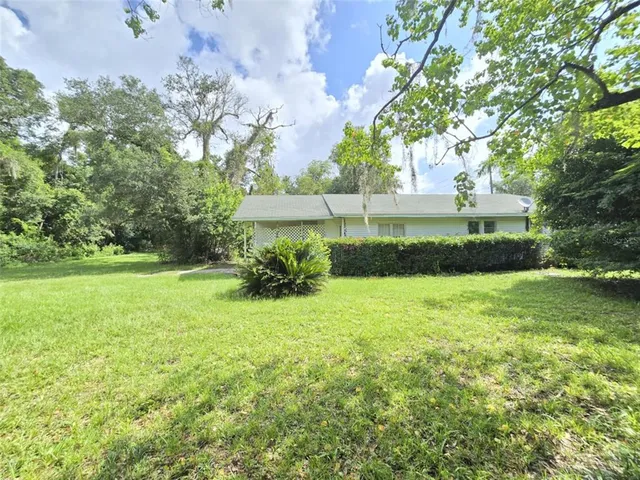 a view of backyard with green space