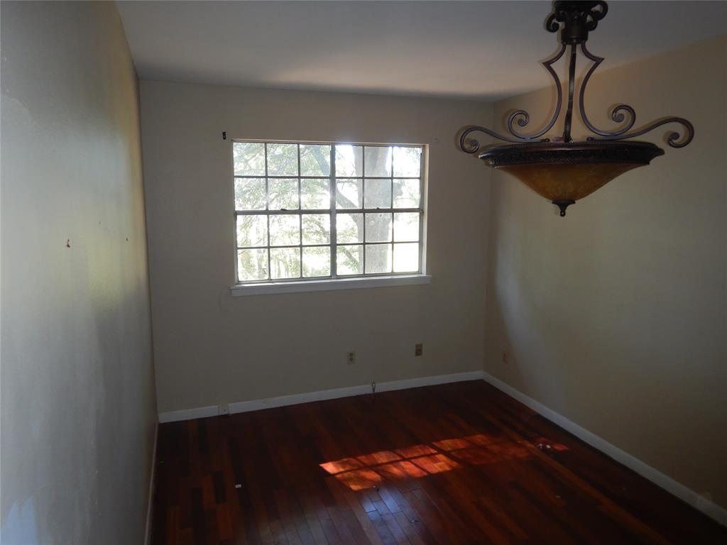 907 Japonica Lane Shreveport, LA 71118 - Photo 14 of 17 a view of room with hardwood floor and window