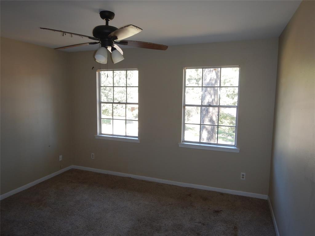 907 Japonica Lane Shreveport, LA 71118 - Photo 15 of 17 an empty room with a window and a fan