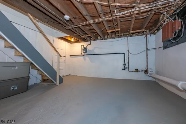 a view of storage and utility room with stairs