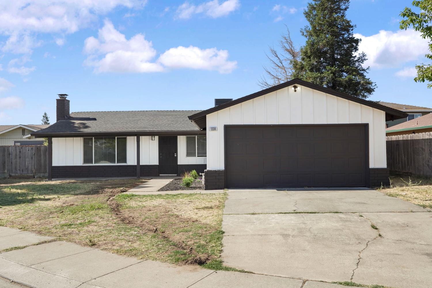 1338 Alfa Romeo Court Manteca, CA 95337 - Photo 1 of 1 a front view of a house with a yard