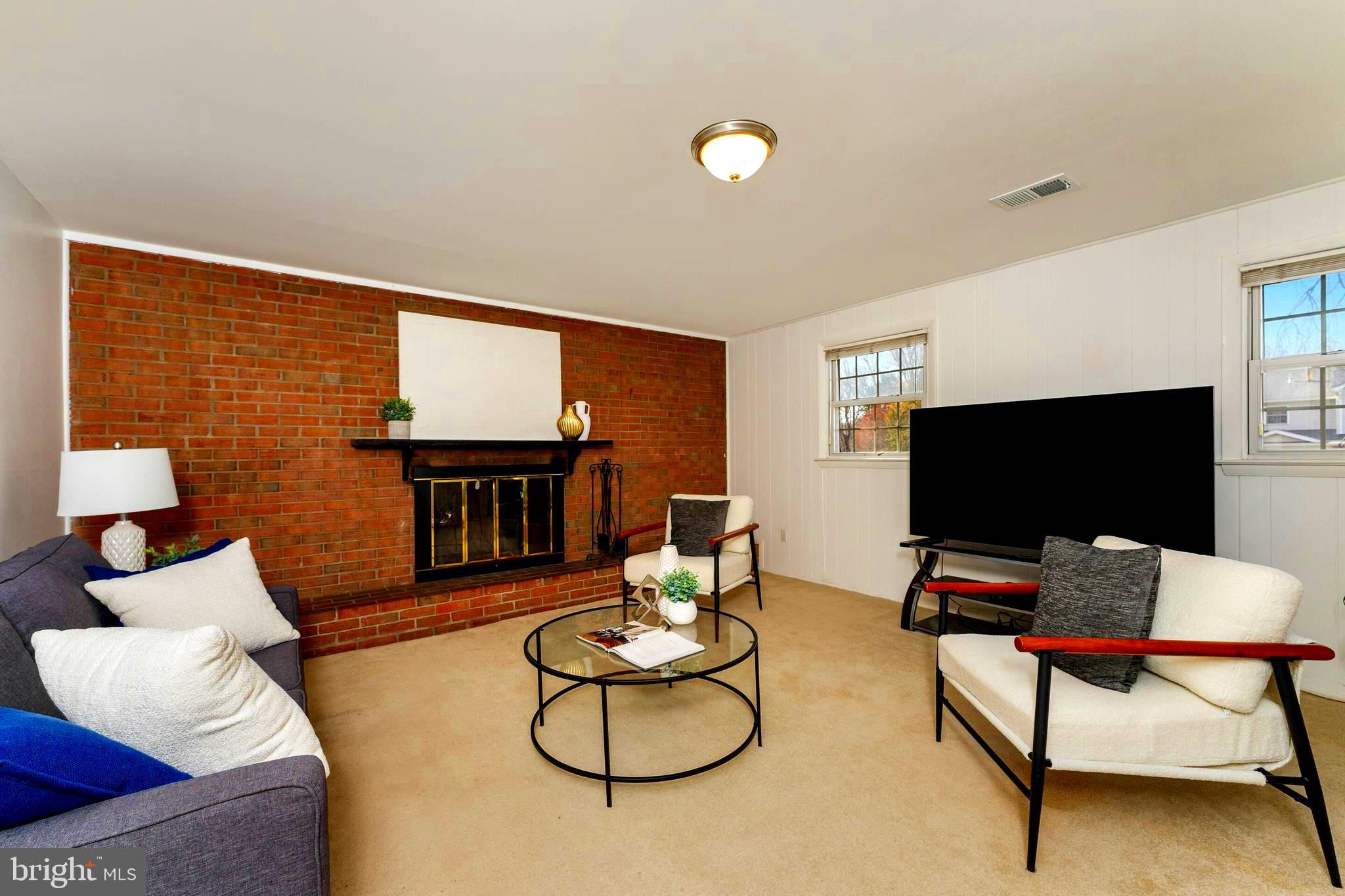 7013 Galgate Drive Springfield, VA 22152 - Photo 17 of 58 REC ROOM W/FULL BRICK WALL WOOD BURNING FIREPLACE