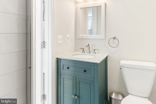 a bathroom with a glass door shower