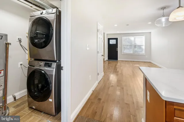 a kitchen with stainless steel appliances a sink stove and cabinets