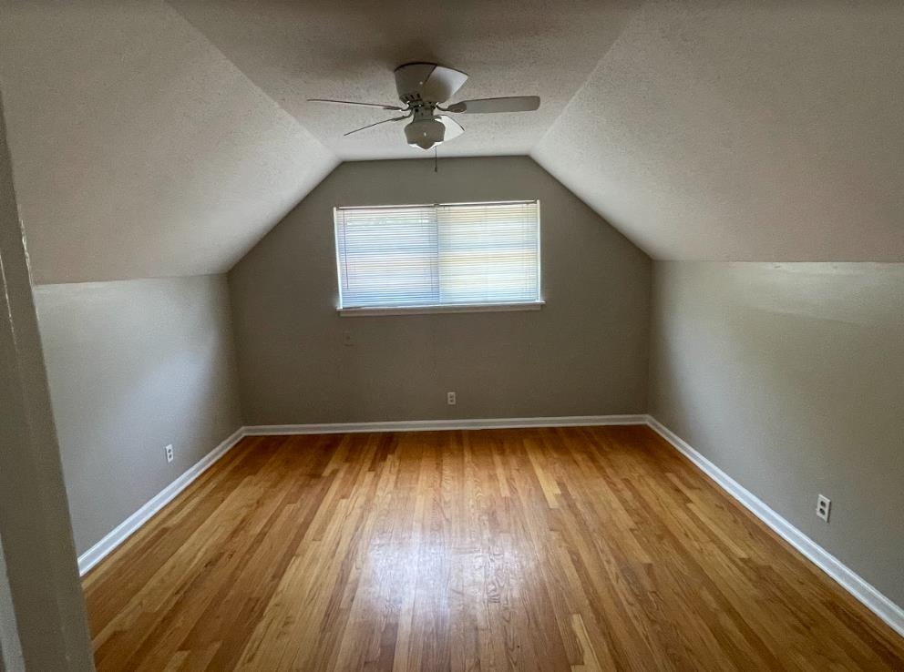 4875 Knight Arnold Road Memphis, TN 38118 - Photo 13 of 16 wooden floor in an empty room with a window