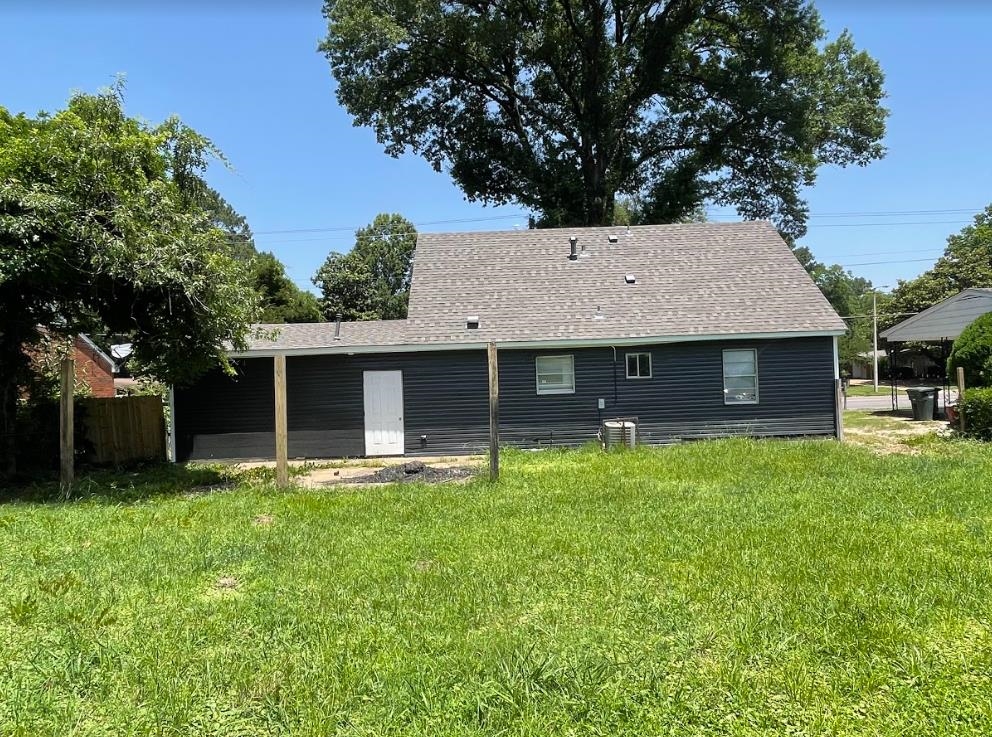 4875 Knight Arnold Road Memphis, TN 38118 - Photo 16 of 16 a front view of a house with a yard and garage
