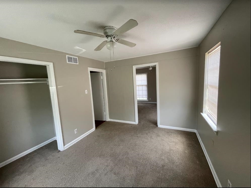 4875 Knight Arnold Road Memphis, TN 38118 - Photo 10 of 16 a view of an empty room with a window