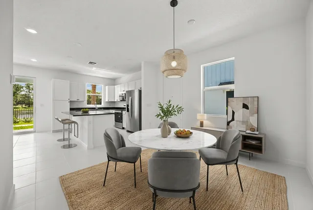 a bedroom with a bed and painting on the wall