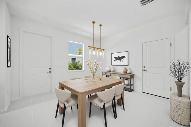 a bathroom with a sink a toilet a mirror and shower