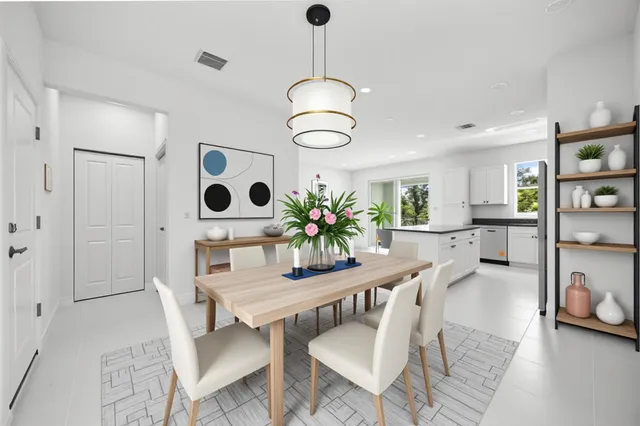 a kitchen with a sink and refrigerator