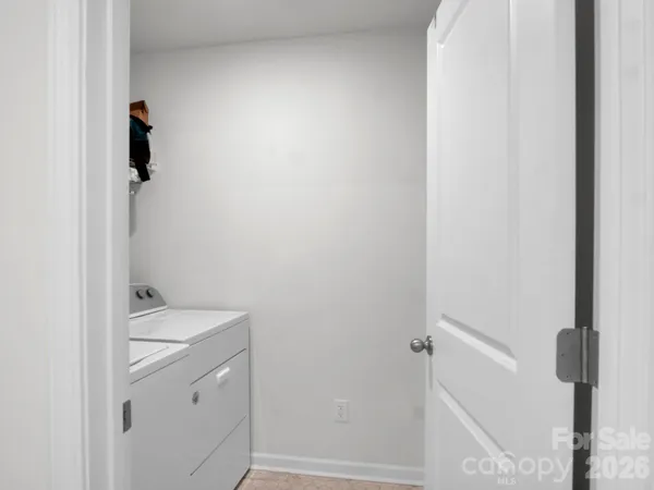 a bathroom with a granite countertop shower and a sink