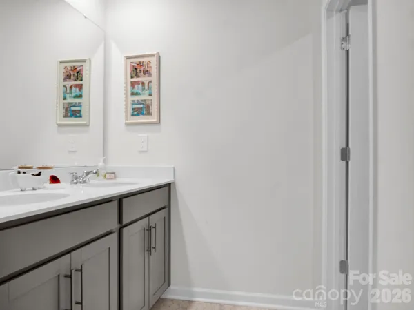 a white toilet sitting next to a shower curtain