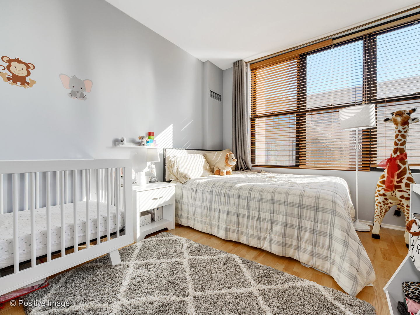 330 North Jefferson Street, Unit 904 Chicago, IL 60661 - Photo 23 of 27 a bedroom with a bed and windows