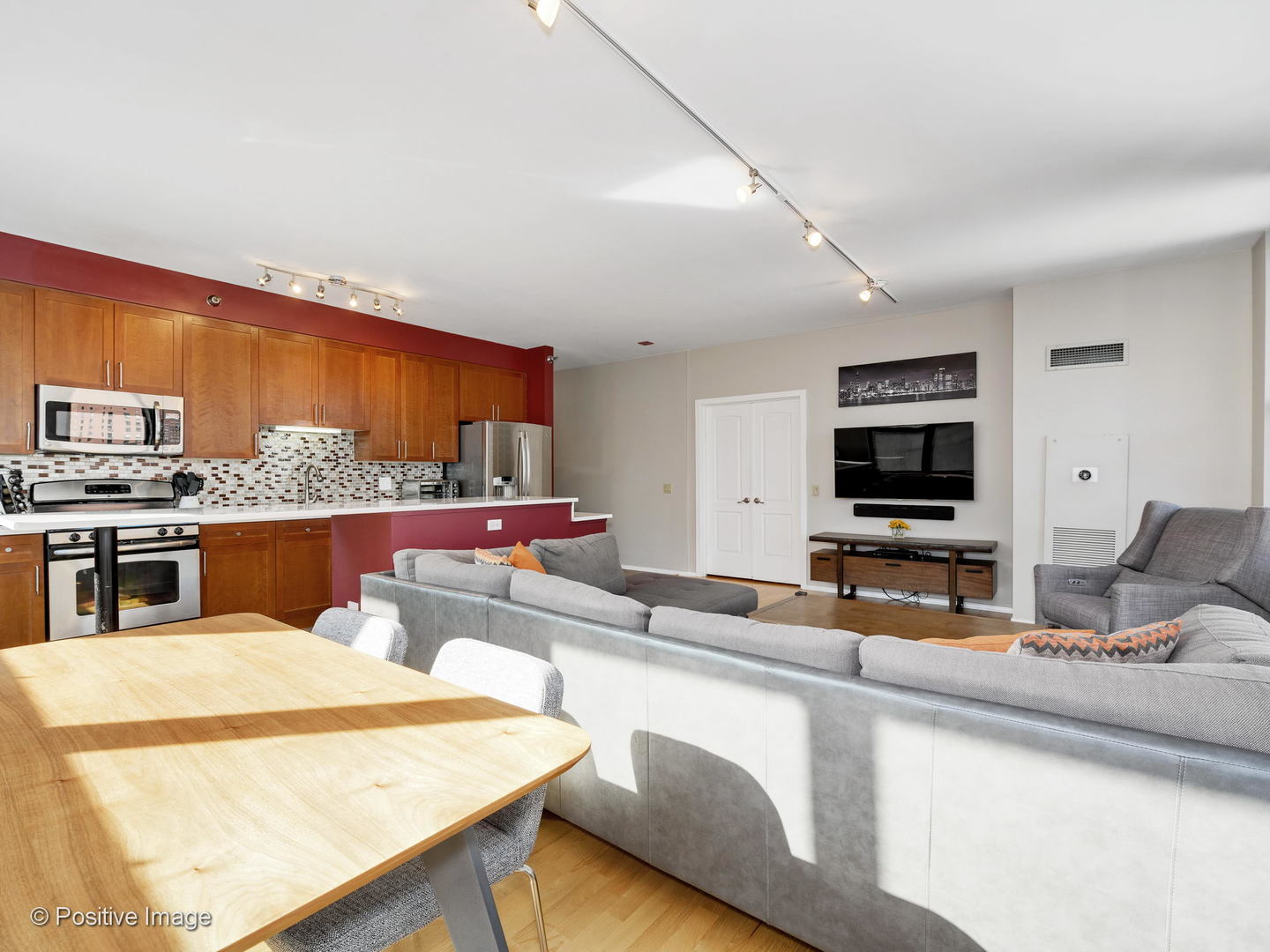 330 North Jefferson Street, Unit 904 Chicago, IL 60661 - Photo 6 of 27 a kitchen with stainless steel appliances kitchen island granite countertop a sink and cabinets