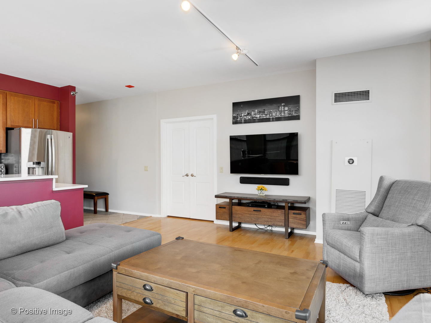 330 North Jefferson Street, Unit 904 Chicago, IL 60661 - Photo 7 of 27 a living room with furniture and a flat screen tv