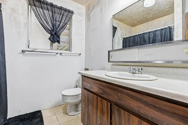 a view of a bathroom from a hallway