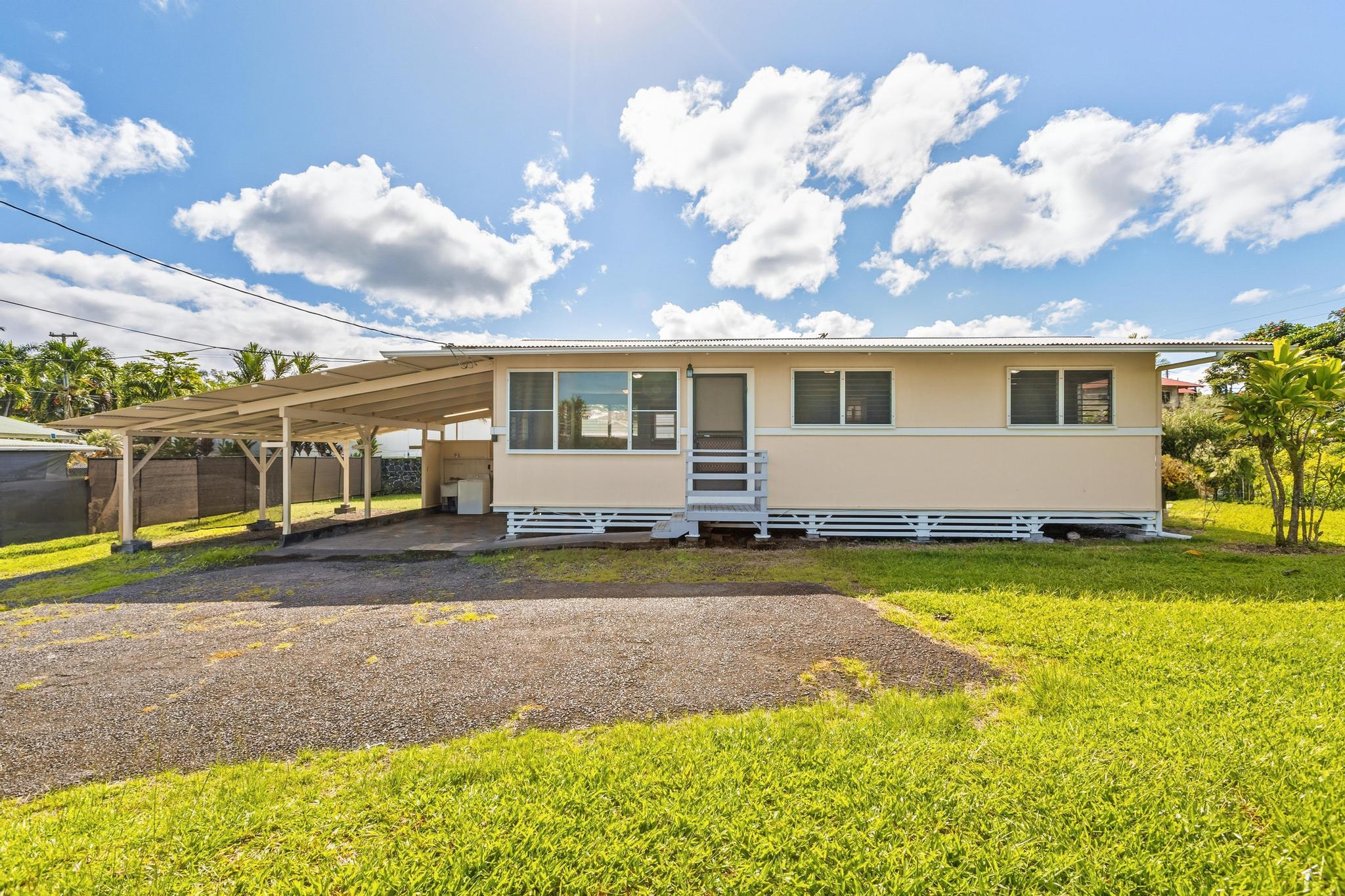 1560 Kilauea Avenue Hilo, HI 96720 - Photo 2 of 29 a front view of a house with garden