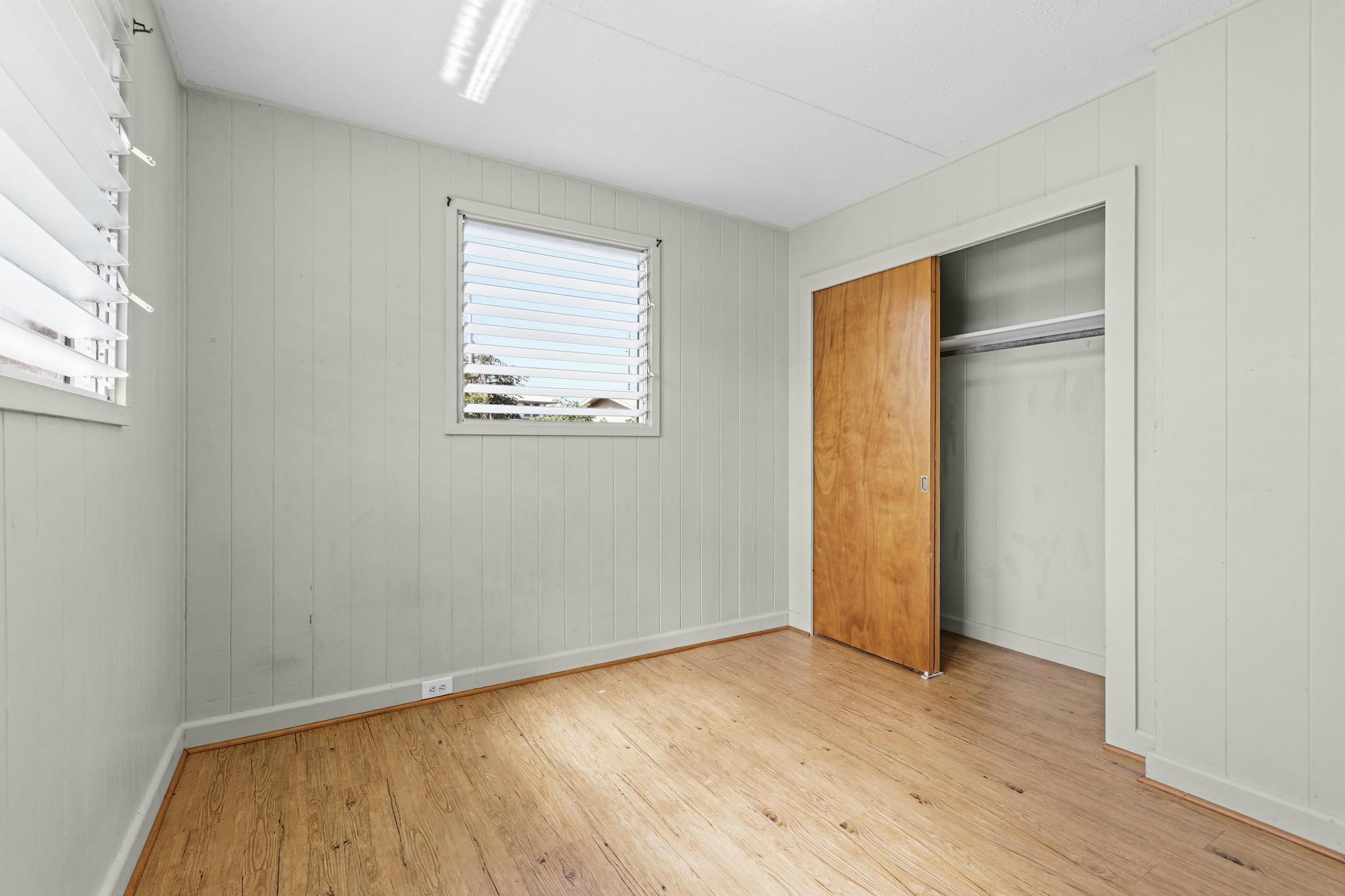 1560 Kilauea Avenue Hilo, HI 96720 - Photo 25 of 29 an empty room with wooden floor and a window