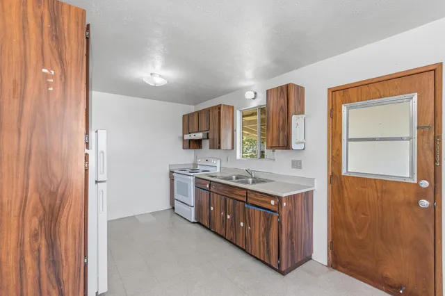 an empty room with a empty space and windows