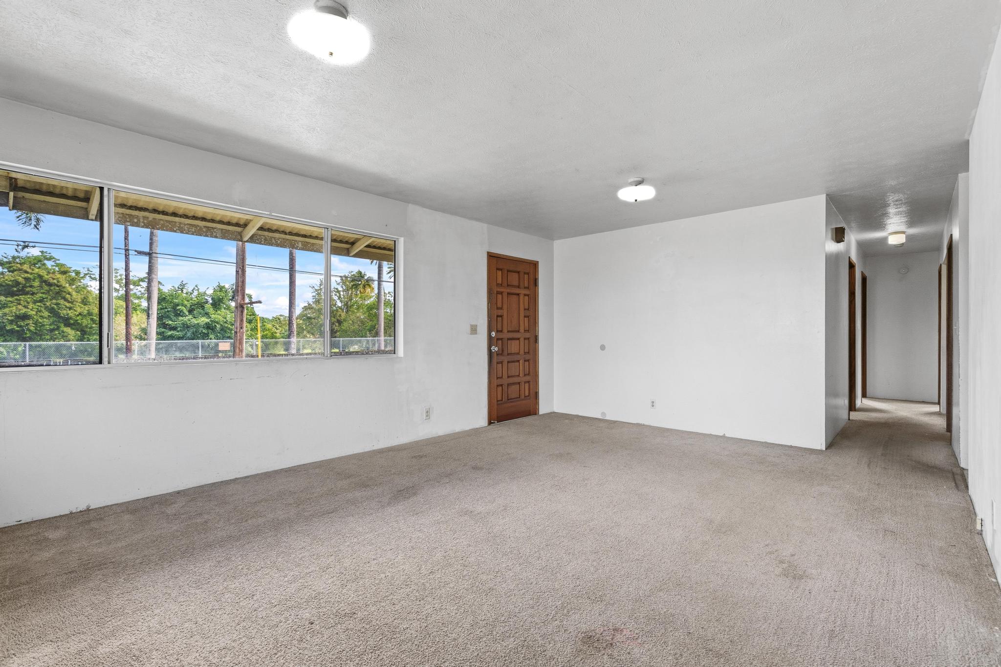 1560 Kilauea Avenue Hilo, HI 96720 - Photo 6 of 29 an empty room with a empty space and windows