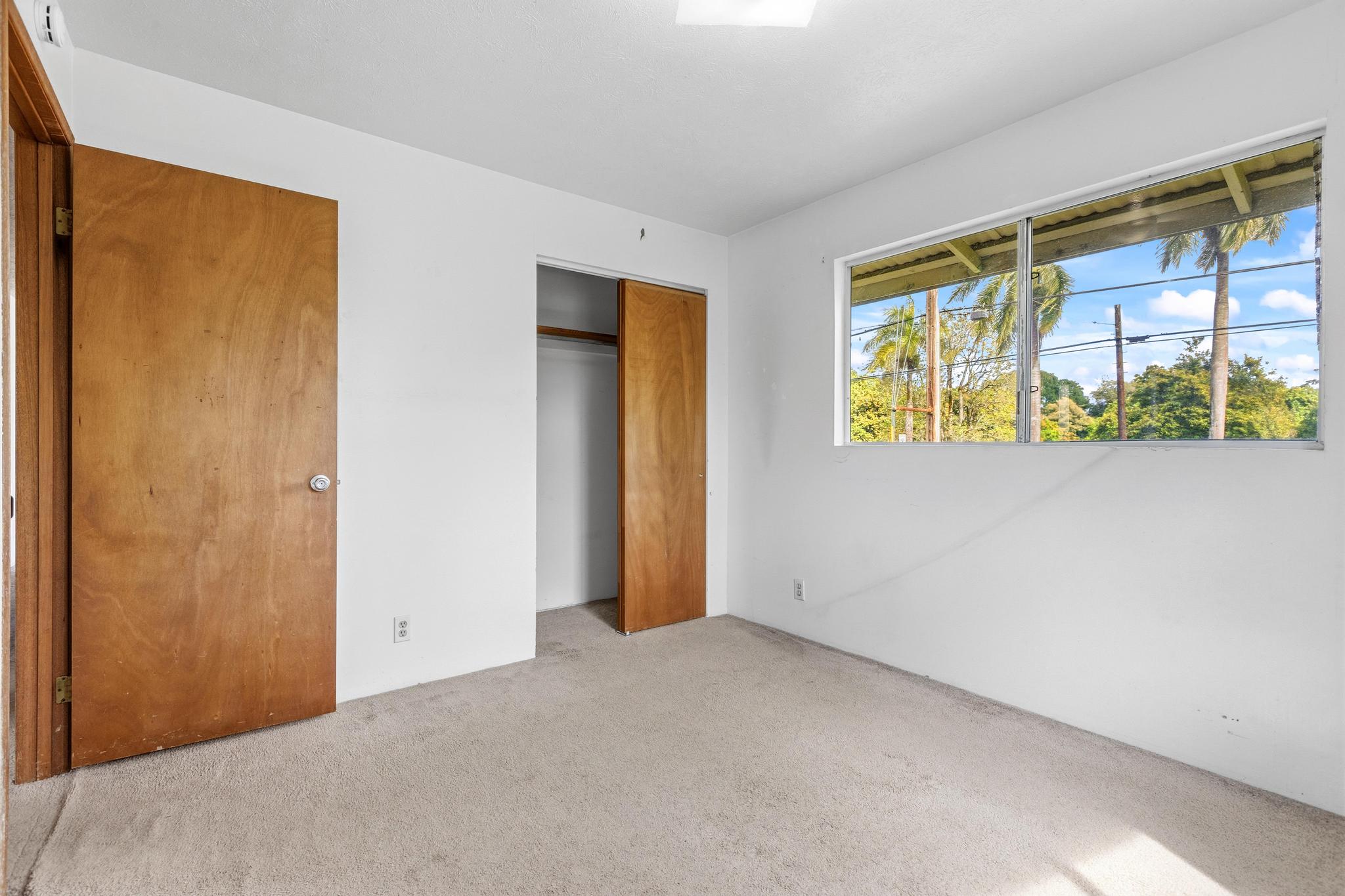 1560 Kilauea Avenue Hilo, HI 96720 - Photo 10 of 29 a view of an empty room with a window