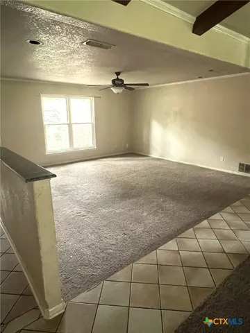 a view of empty room with windows