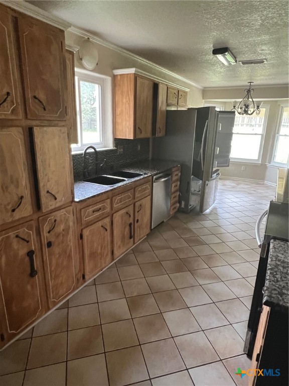 1600 Halbert Street Killeen, TX 76541 - Photo 6 of 15 a kitchen with stainless steel appliances a sink stove and cabinets