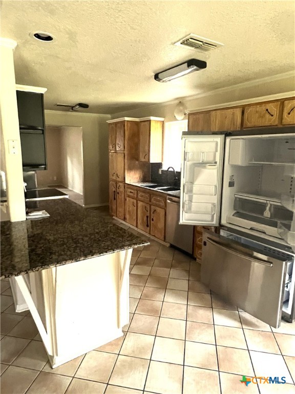 1600 Halbert Street Killeen, TX 76541 - Photo 8 of 15 a kitchen with granite countertop a sink and a stove
