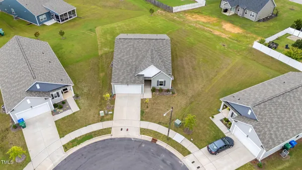 an aerial view of a house with a swimming pool