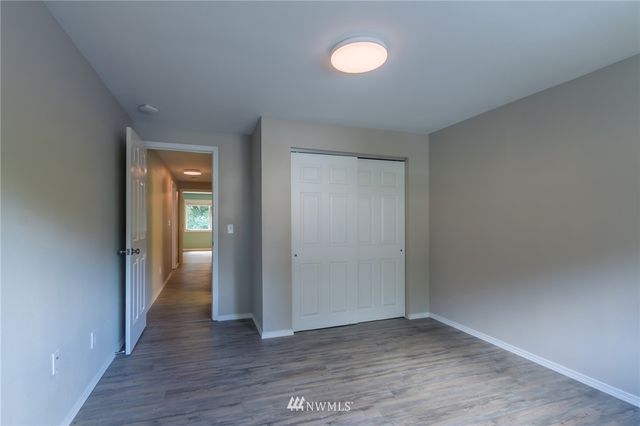 a view of an empty room and a window