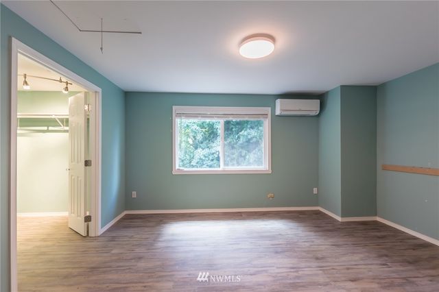 a bathroom with a sink vanity and mirror
