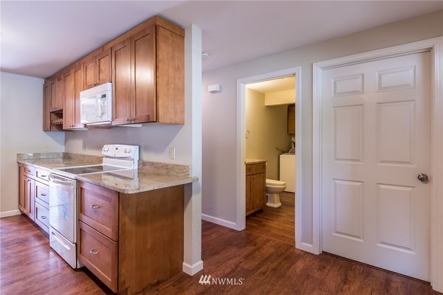 a view of entryway with wooden floor
