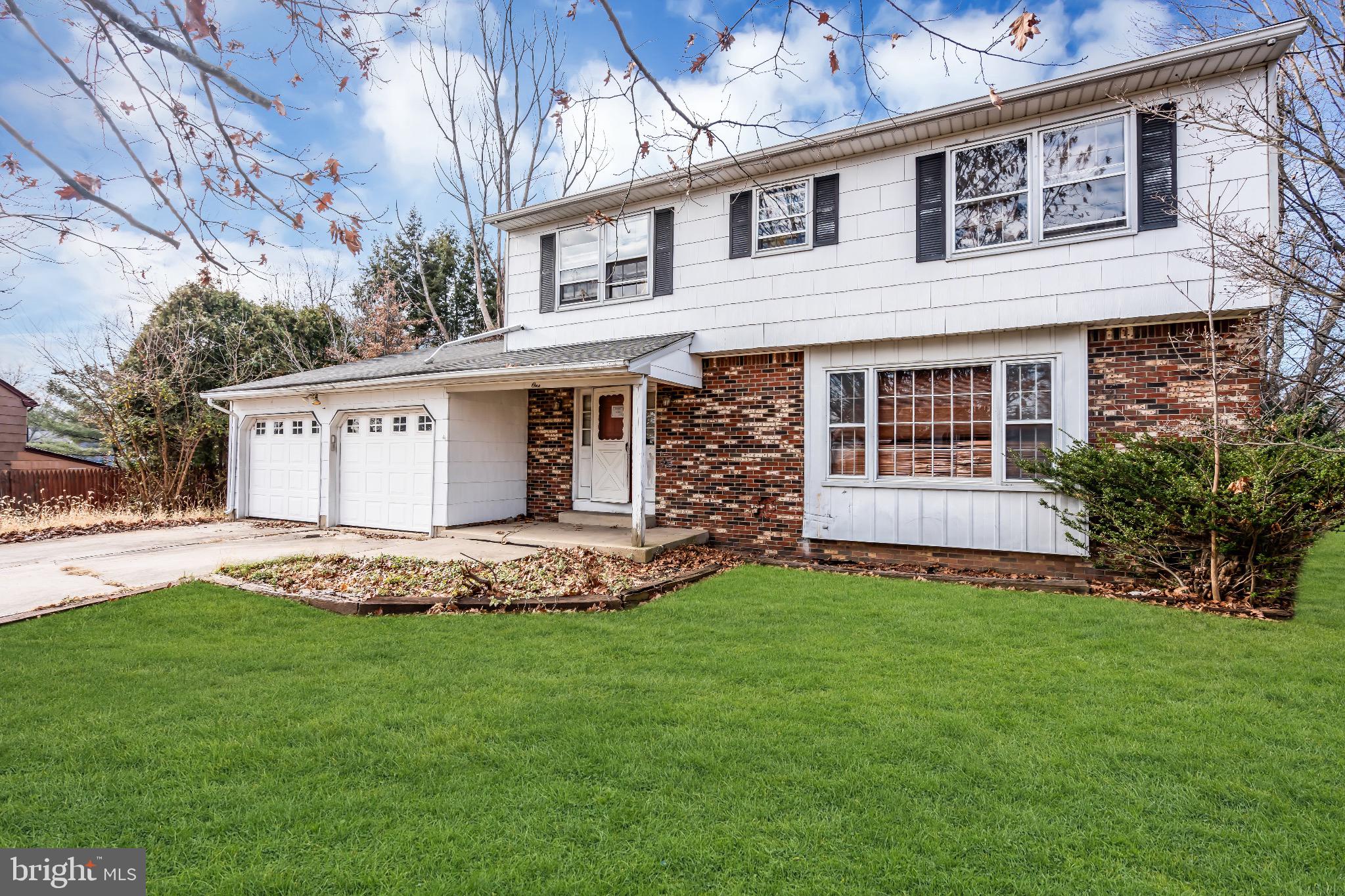1 Colleen Circle Ewing, NJ 08638 - Photo 2 of 12 a view of a white house with a yard and large tree