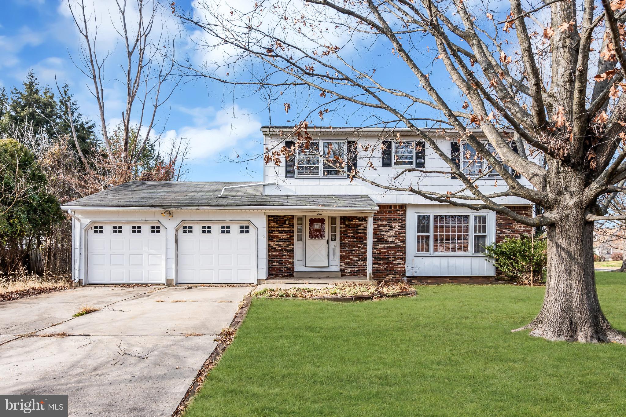 1 Colleen Circle Ewing, NJ 08638 - Photo 3 of 12 front view of a house with a garden