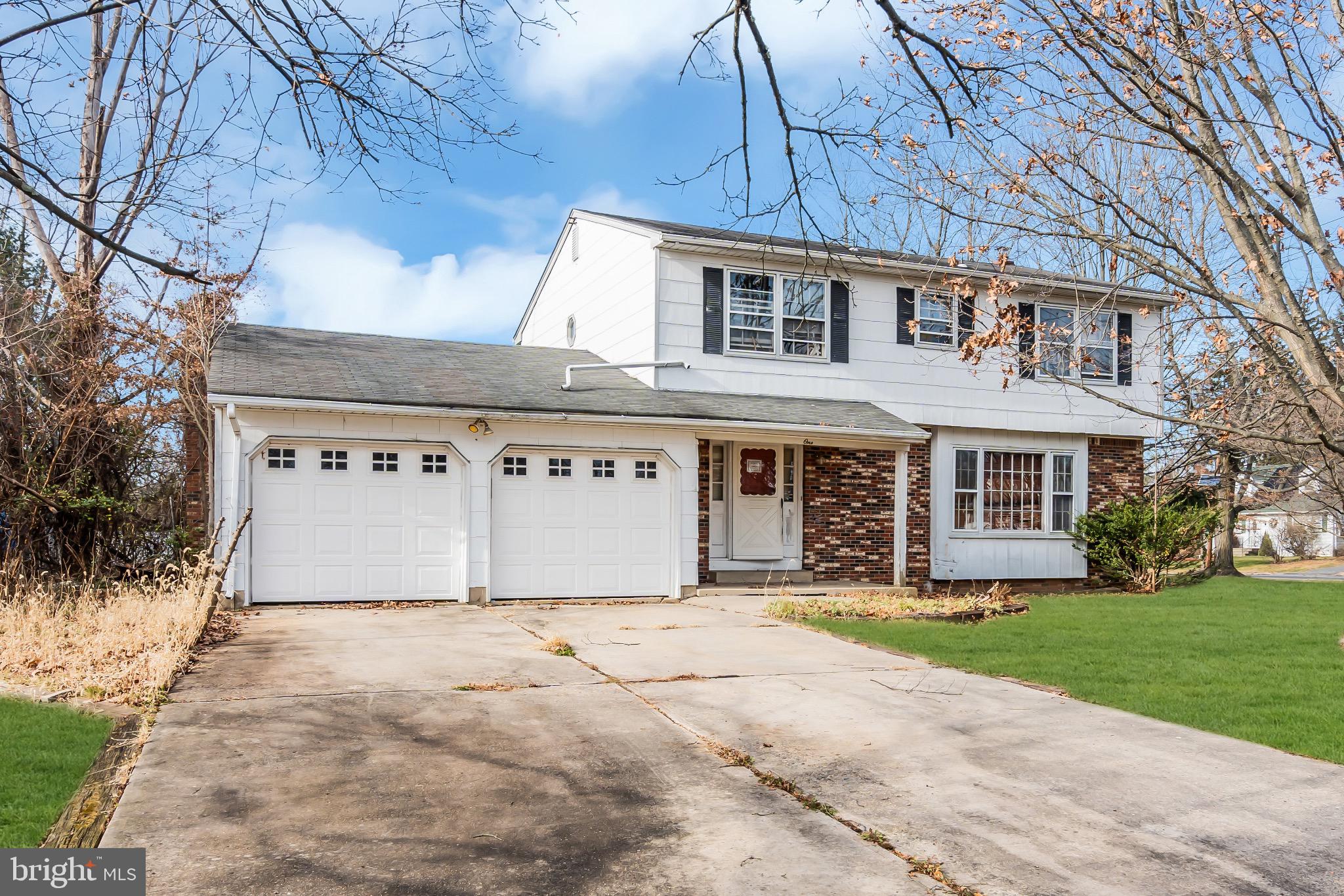 1 Colleen Circle Ewing, NJ 08638 - Photo 7 of 12 a front view of house with yard and garage