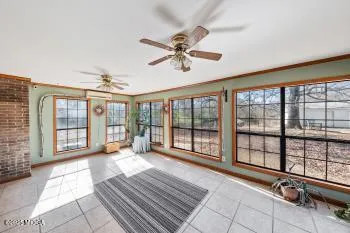 a view of a room with windows