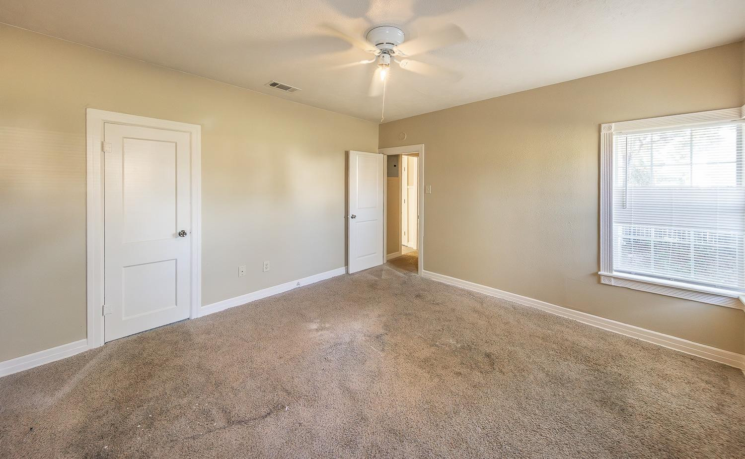2104 14th Street Lubbock, TX 79401 - Photo 9 of 17 a view of an empty room with a window