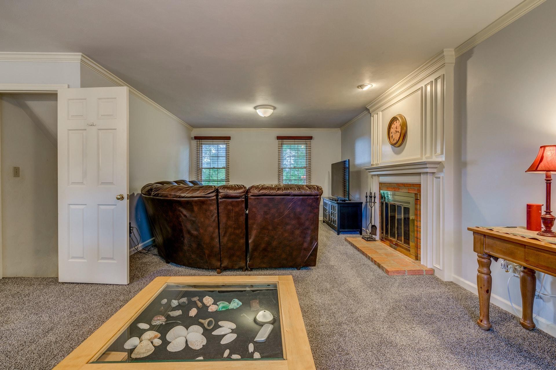366 Stonehaven Lane Blue Ridge, VA 24064 - Photo 15 of 37 a living room with furniture and a fireplace