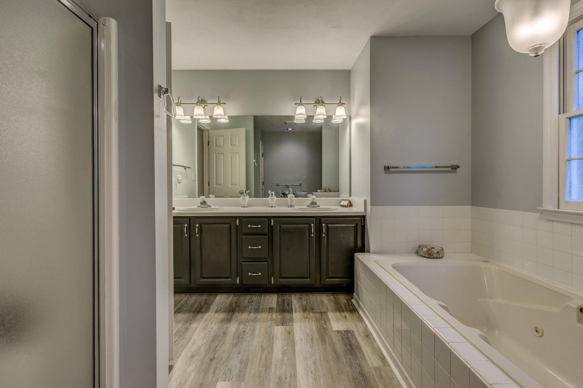 366 Stonehaven Lane Blue Ridge, VA 24064 - Photo 20 of 37 a bathroom with a tub a sink and a mirror